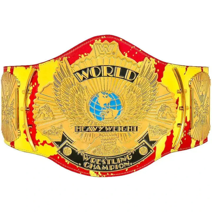 Front view of a Hulk Hogan championship belt with gold plates, eagle artwork and a red and yellow strap.