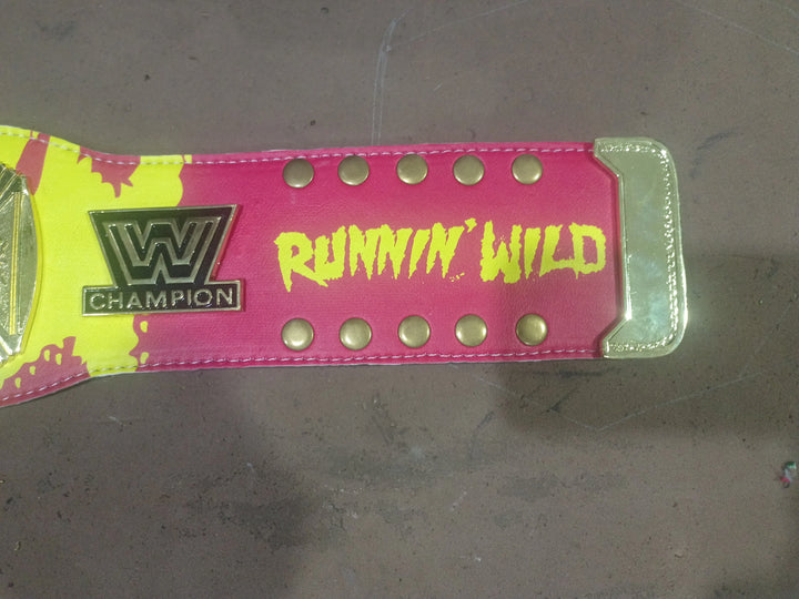 Close-up of the Hulk Hogan belt strap with Runnin’ Wild text, gold snaps and championship logo.
