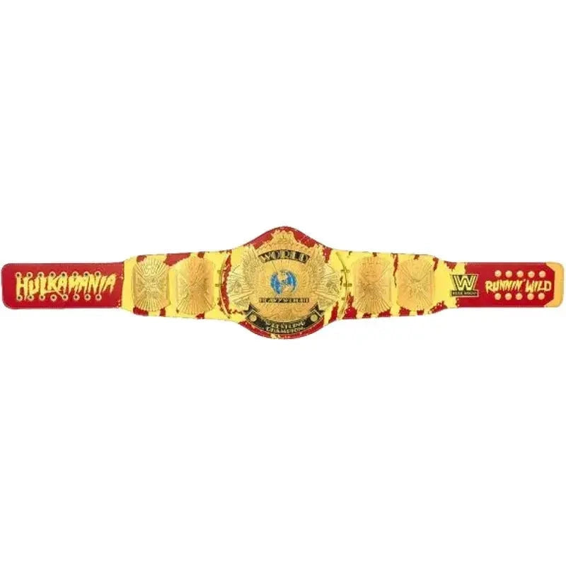 Full view of a Hulkamania championship belt with gold plates, red-yellow strap and Runnin’ Wild text.