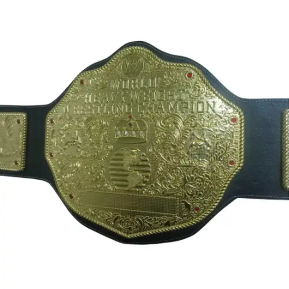 Custom gold-plated World Heavyweight Wrestling Champion belt with red gems and leather strap.