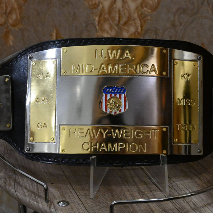 NWA Mid-America championship replica belt with gold and silver plates on a black leather strap