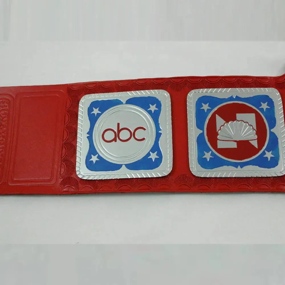 Close-up of red NWA Television Championship belt featuring ABC logo and blue star accents