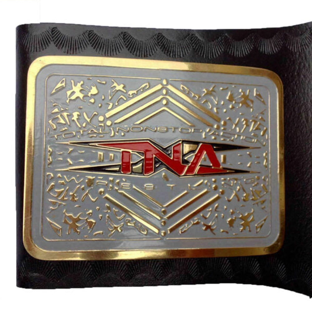 TNA Impact World Championship belt with gold and silver plate and red TNA logo on black strap