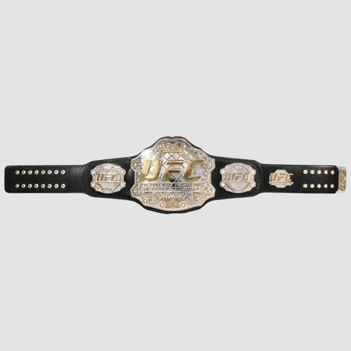 Full-length UFC championship belt with gold plates and a black leather strap on a white background.