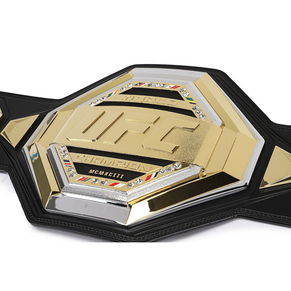 Close-up of UFC legacy replica belt with gold and black detailing from Championship Belts Online